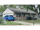 Inviting single-story home featuring a well-kept lawn, light siding, and a spacious driveway with room for multiple vehicles at 1902 Edgemont Way, Anderson, IN 46011