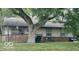 Charming single-story home with neutral siding, brick foundation, and well-manicured lawn, offering cozy curb appeal at 1902 Edgemont Way, Anderson, IN 46011