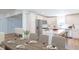Eat in kitchen with stainless steel appliances, white cabinets, and island with seating at 2068 S Avon Ave, Avon, IN 46123