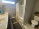 Bathroom showcasing double sinks, tile flooring, shower and a view of the toilet at 2018 Abbey Ln, Columbus, IN 47201