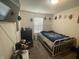 Cozy bedroom with a metal bed frame and decor and window providing natural light at 2018 Abbey Ln, Columbus, IN 47201