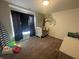 Cozy Bedroom with a large window, mural on the wall, crib, and neutral carpet at 2018 Abbey Ln, Columbus, IN 47201