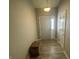 Inviting foyer with wood-look flooring and access to the main living areas at 2018 Abbey Ln, Columbus, IN 47201