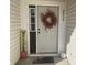 Inviting front entrance adorned with a decorative wreath and seasonal decor at 2018 Abbey Ln, Columbus, IN 47201