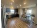 Modern kitchen featuring stainless steel appliances, dark cabinetry, and a breakfast nook at 2018 Abbey Ln, Columbus, IN 47201