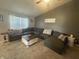 Spacious living room with plush seating, neutral tones, and ample natural light at 2018 Abbey Ln, Columbus, IN 47201
