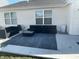 Back patio featuring outdoor seating and a sleek, minimalist design at 2018 Abbey Ln, Columbus, IN 47201
