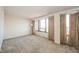Spacious bedroom featuring neutral walls, carpet flooring, and natural light from the large window at 4000 N Meridian St # 14A, Indianapolis, IN 46208