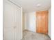 Neutral entryway featuring carpet, entry door and white painted closet doors at 4000 N Meridian St # 14A, Indianapolis, IN 46208