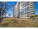 A condominium building featuring multiple stories, balconies, and a well-manicured lawn at 4000 N Meridian St # 14A, Indianapolis, IN 46208