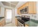 Kitchen featuring wooden cabinets and stainless steel appliances at 4000 N Meridian St # 14A, Indianapolis, IN 46208