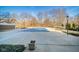 A gated community pool is covered in the off-season in a concrete patio area with mature landscaping at 4000 N Meridian St # 14A, Indianapolis, IN 46208