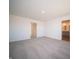 Neutral bedroom with neutral carpet and access to ensuite bathroom and hallway at 7888 Magnolia St, New Palestine, IN 46163