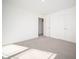Spacious bedroom with neutral carpet, white walls and trim and plenty of natural light at 7888 Magnolia St, New Palestine, IN 46163