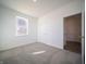 Bright bedroom featuring a window and neutral-toned carpeting at 7888 Magnolia St, New Palestine, IN 46163