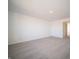 Bright bedroom with neutral carpet with doorway to another part of the home at 7888 Magnolia St, New Palestine, IN 46163