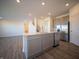 Bright kitchen with stainless steel appliances, gray cabinets, and a quartz countertop island at 7888 Magnolia St, New Palestine, IN 46163