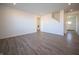 Spacious living room featuring modern hardwood flooring and an open floor plan at 7888 Magnolia St, New Palestine, IN 46163