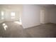 Spacious living room with plush gray carpet and bright, natural light at 7888 Magnolia St, New Palestine, IN 46163