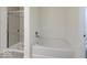 Clean bathroom with a shower with glass door and separate soaking tub at 3567 Windstar Ct, Columbus, IN 47203