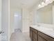 Bathroom featuring a double vanity with framed mirror and neutral paint at 3567 Windstar Ct, Columbus, IN 47203
