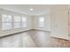 Bright, sunlit bedroom features hard surface floors and bright neutral paint at 3567 Windstar Ct, Columbus, IN 47203