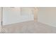 Bright, carpeted bedroom showcasing neutral tones and a half wall feature at 3567 Windstar Ct, Columbus, IN 47203