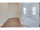 Inviting entryway with wood flooring, leading into a carpeted room with ample natural light at 3567 Windstar Ct, Columbus, IN 47203