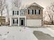 Charming two-story home featuring a two-car garage and a welcoming front porch at 3567 Windstar Ct, Columbus, IN 47203