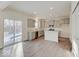 An open kitchen features gray cabinets, an island, stainless steel appliances, and wood-look flooring at 3567 Windstar Ct, Columbus, IN 47203