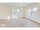 Airy living room featuring wood flooring, recessed lighting, and multiple windows for ample natural light at 3567 Windstar Ct, Columbus, IN 47203