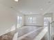 Open-concept living area with wood flooring, recessed lighting, and a sliding glass door to the yard at 3567 Windstar Ct, Columbus, IN 47203