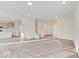 Bright, open-concept living area featuring wood flooring and seamless flow to the kitchen and dining spaces at 3567 Windstar Ct, Columbus, IN 47203