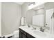 Bathroom featuring a double sink vanity, a large mirror, and modern fixtures at 5424 Pembridge Ln, Zionsville, IN 46077