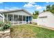 Home with backyard, enclosed porch, and a shed at 1127 S Pershing Ave, Indianapolis, IN 46221