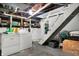 Basement laundry area with washer and dryer and a staircase at 1127 S Pershing Ave, Indianapolis, IN 46221