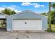 Garage with a roll up door and exterior siding at 1127 S Pershing Ave, Indianapolis, IN 46221