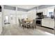 Open kitchen and dining area with stainless steel appliances and updated cabinets at 1127 S Pershing Ave, Indianapolis, IN 46221