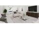 Bright living room featuring neutral decor, large windows, and a modern glass coffee table for a clean, inviting space at 1127 S Pershing Ave, Indianapolis, IN 46221