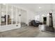 Open-concept living area with hardwood flooring, neutral walls, and staircase, creating an airy and spacious feel at 1127 S Pershing Ave, Indianapolis, IN 46221