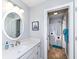 Well-lit bathroom featuring a single vanity with ample counter space and a shower/tub combo at 5826 Winding Way Ln, Indianapolis, IN 46220