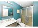 Bathroom featuring a modern vanity, a large mirror, toilet, and a shower with sliding glass doors at 5826 Winding Way Ln, Indianapolis, IN 46220
