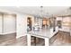 Bright, open kitchen with a large island, modern cabinets, and stainless steel appliances at 5826 Winding Way Ln, Indianapolis, IN 46220