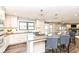 Modern kitchen with a large island, quartz countertops, and stainless steel appliances at 5826 Winding Way Ln, Indianapolis, IN 46220