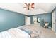 Spacious main bedroom featuring a vaulted ceiling, stylish fan, and a patterned area rug at 5826 Winding Way Ln, Indianapolis, IN 46220