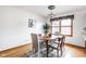 Bright dining area with a wooden table, stylish chairs, and a decorative rug at 7655 Westerville Dr, Clayton, IN 46118