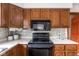 Functional kitchen with ample cabinet space, modern appliances, and a neutral color scheme at 7655 Westerville Dr, Clayton, IN 46118