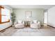 Cozy living room featuring comfortable seating, a decorative rug, and a calming color palette at 7655 Westerville Dr, Clayton, IN 46118