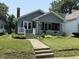 A well-kept single-story home with a manicured lawn and sidewalk leading to the entrance at 2811 Fenwood Ave, Terre Haute, IN 47803