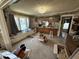 View of the carpeted living room open to the kitchen at 2811 Fenwood Ave, Terre Haute, IN 47803